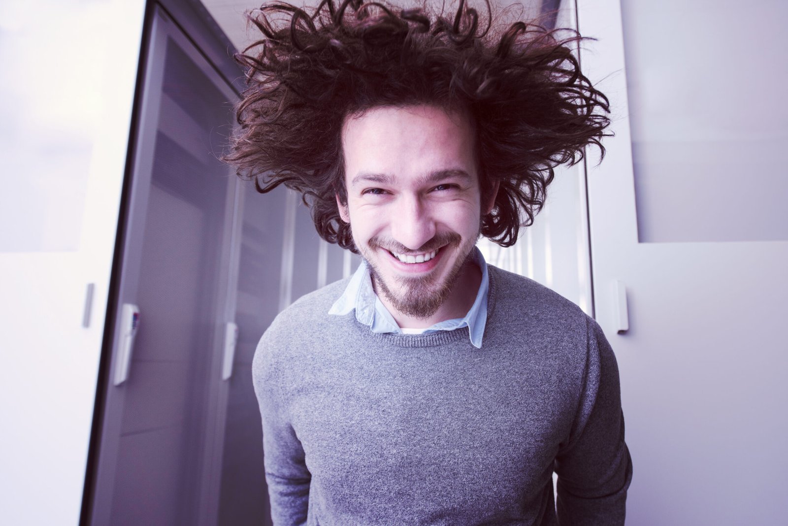 portrait of young handsome IT engeneer in datacenter server room